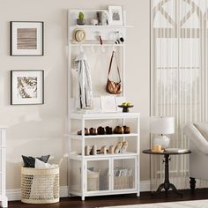 there is a white shelf with shoes and purses on it in the living room