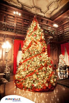 a large christmas tree in the middle of a room