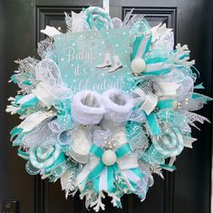 a baby it's cold outside wreath on the front door