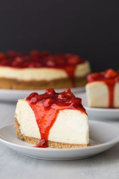 cheesecake with strawberry topping on white plate