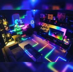 a living room filled with furniture and colorful lights