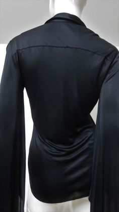 For Sale on 1stDibs - A fabulous black fine stretch silk shirt, top, blouse from Tom Ford for Gucci. It is semi fitted with a shirt collar, black mother of pearl Gucci inscribed Elegant Gucci Blouse For Evening, Elegant Gucci Blouse For Party, Elegant Gucci Party Blouse, Gucci Long Sleeve Evening Tops, Gucci Evening Long Sleeve Tops, Chic Gucci Collared Blouse, Elegant Gucci Office Blouse, Gucci Black Top For Night Out, Black Gucci Top For Party