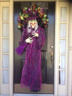 a creepy woman dressed in purple and holding an umbrella on the front door of a house