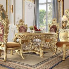 an ornately decorated dining room with gold furniture