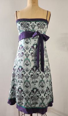 "Very small fit, 32 breast. Brand \"To the Max\" size 6 Empire waist silk dress with a light damask motif. Pale teal with purple belt and purple and teal motives. Very delicate silky dress with a zipper on the back." Teal Silk Dress, Vintage Silk Dress, Dress Empire Waist, Purple Belt, Silk Dress Vintage, Waist Line, Purple Bow, Purple Bows, Evening Dresses Short