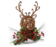 a christmas decoration with antlers and berries