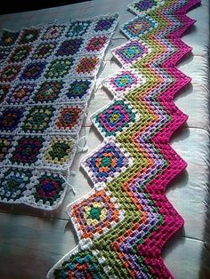 two crocheted rugs sitting on top of a table