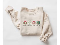 Surprise everyone this holiday season with our funny and cozy Christmas pregnancy sweatshirt reveal gift! This soft pregnancy reveal sweater is perfect for sharing the big news in a fun way. With a clever design, it's a playful pregnant announcement crewneck that will get smiles all around. Ideal for chilly days, this funny maternity fall shirt lets you show off your bump in style. Whether you're expecting or shopping for a mom-to-be, this preggers sweatshirt is the perfect festive addition to your wardrobe!   *Fast shipping in 2-5 Business Days! *Comfy unisex sweatshirts are soft and durable. *Measuring tip: Take your favorite sweatshirt or tee, lay it on a flat surface and measure the width (armpit to armpit) and length (top to bottom), then compare with our size chart. *Classic fit, dur Pregnancy Sweatshirt, Pregnant Announcement, Funny Maternity, Christmas Pregnancy, Fall Maternity, Pregnancy Humor, Pregnancy Reveal, Big News, Pregnancy Reveals