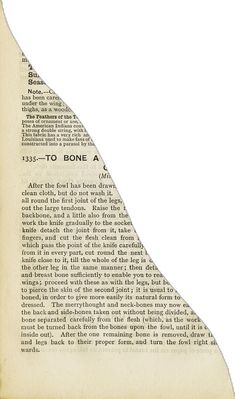 an old book page with the shape of a triangle in it's center and bottom corner