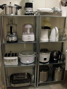 the shelves are filled with appliances and blenders