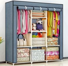 an open closet with clothes and handbags on the bottom shelf, in front of a white background