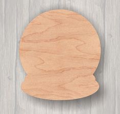 an unfinished wooden bunny head on a white wood background with clipping for text or image