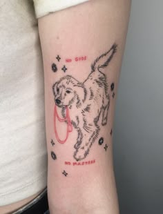 a dog with a leash tattoo on the arm