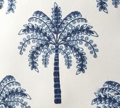 a blue and white palm tree print fabric