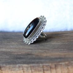 Black onyx ring, Sterling Silver ring, cocktail ring, alternative engagement ring, black onyx jewelry, Valentine's day jewelry, silver jewellery Description: Be assured that the product you order is MADE JUST FOR YOU and is not a mass produced item. The gemstone is a cushion shaped BLACK ONYX The rest of the ring is made from 925 STERLING SILVER i.e 92.5% pure silver. And it DOESN'T HAVE ANY LEAD OR NICKEL. I make more than 50 DIFFERENT GEMSTONES. If you want other gemstones, Please inbox me. I' Elegant Silver Jewelry With Large Stone, Classic Large Stone Promise Ring, Elegant Sterling Silver Jewelry With Large Stone, Classic Onyx Ring Jewelry, Elegant Adjustable Crystal Ring With Stone Setting, Classic Onyx Ring, Unique Black Crystal Ring In Sterling Silver, Fine Jewelry Ring With Large Stone, Classic Onyx Open Ring Jewelry