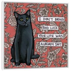 a black cat sitting on top of a red floral wallpaper with words above it