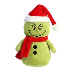 a green stuffed snowman wearing a santa hat