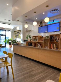 the inside of a restaurant with tables and chairs