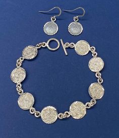 Beautiful Vintage Mexico Sterling Silver Mayan Aztec Medalion Coin Links Diamond Cut Bracelet with Matching Earring Set pre/owned condition measures bracelet 7.5" inches length toggle clasp and each round coin like is 12mm and earrings measure little over 1" inches. Vintage Mexico, Toggle Clasp, Diamond Cut, Sterling Silber, Matching Earrings, Favorite Jewelry, Earring Set, Jewelry Sets, Diamond Cuts