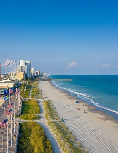 an aerial view of the beach and boardwalk