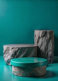 three different types of marbles on a table in front of a blue wall and green walls