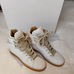 Maison Martin Margiela For H&M Off White High Top Sneakers. Eur 36. H&M 5 Which Is Equivalent To Us 6. Great Condition, Only A Few Scuffs. Unisex. Faux Leather Exterior, Leather Interior. Comes With Original Box And Dust Bag. H&m Shoes, White High Tops, Leather Interior, Womens Shoes Sneakers, High Tops, High Top Sneakers, H&m, Faux Leather, Cream