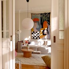 a living room filled with furniture and decor