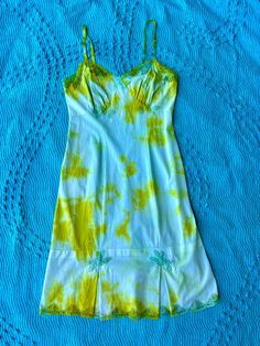 Expertly hand dyed nylon vintage slip dress. Layer this look over a turtle neck in the winter or over a swimsuit by the pool, they're great on their own too! This vintage slip has been carefully tie dyed to disguise stains and discoloration. Originally white, it has a unique all over tie dye pattern in lime green and teal. Can be washed on cold with like colors. This is a one of one item This slip is in very good vintage condition. There are no holes or tears. The straps are adjustable. Bust: 40" Waist: 34" Hips: 42" Length: 42" Tie Dye Dresses, Teal Tie, Vintage Slip Dress, West Chester Pa, Dress Layer, One Of One, Vintage Slip, Tie Dye Pattern, High Leather Boots