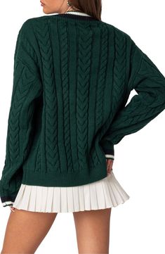 Classic cables and striped trim prep up this sweater knit from supersoft yarns in an oversized fit that layers over your tennis togs or anything else. V-neck Long sleeves with ribbed cuffs 100% Acrilan acrylic Hand wash, dry flat Imported Cozy Green Sweater With Ribbed Collar, Striped Long Sleeve Cable Knit Sweater, Preppy Knit Sweater For Fall, Green Sweater With Ribbed Cuffs For College, Preppy Winter Sweater With Ribbed Collar, Preppy Knit Sweater For Winter, Preppy College Sweater For Winter, Preppy College Sweater For Fall, Preppy Fall College Sweater