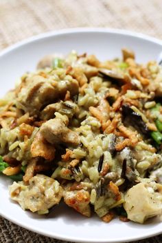 a white plate topped with rice and vegetables