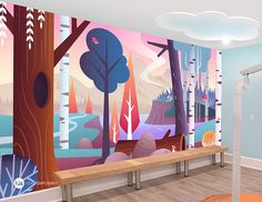 a bench in front of a colorful forest mural on the wall next to a stair case