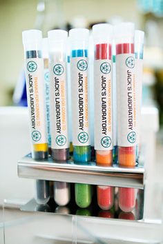 there are many different colored tubes in the holder