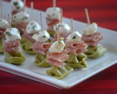 small appetizers with toothpicks and cheese on them