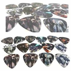 several guitar picks with different pictures on them