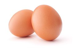 two brown eggs sitting next to each other