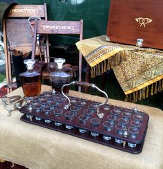 an old fashioned machine is on display in front of other antique items