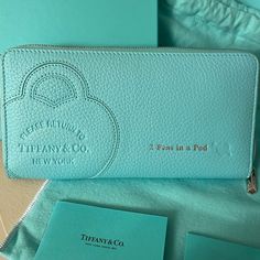 Never Used Return To Tiffany, Tiffany & Co. Zip Wallet Embossed With Silver “2 Peas In A Pod ” Comes With Tiffany And Company, Dust Bag, Tissue Paper, Store Bag And Box! Makes An Amazing Gift For Your Loved One. Tiffany Blue Taurillon Leather One Interior Pocket With Zipper 16 Interior Card Slots Palladium-Plated Zipper Pull Nappa Leather Lining Made In Italy, Comes From A Smoke-Free Cat Friendly Home. Return To Tiffany, Paper Store, Free Cats, Free Cat, Fancy Bags, Pocket With Zipper, Tiffany And Co, Cat Friendly Home, Zip Wallet