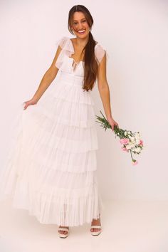 This is an elegant white dress that will make you feel like a princess. It's perfect for a bridal shower, engagement, or wedding. The drop waist and tulle skirt are feminine and beautiful, and the fitted bodice adds a touch of class. Elastic fittings around the chest and sleeves as well. Runs true to size. Size Guide Extra Small Small Medium Large Bust 31.5-32” 33-34” 35-36” 37-28” Waist 24-25” 26-27” 28-29” 29-30” Hips 33-34” 35-36” 37-38” 39-40” Tiered Satin Wedding Dress, White Dresses With Sleeves, Tiered Wedding Dress, White Dress With Sleeves, White Tulle Dress, Elegant White Dress, Engagement Party Dresses, Cute Homecoming Dresses, Formal Dresses For Teens