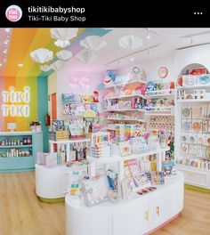 the inside of a toy store filled with lots of toys and books on shelves next to each other