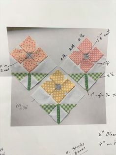 three quilted squares with flowers on them in different colors and sizes, all arranged together