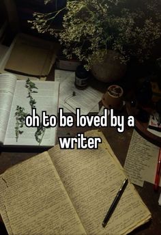 an open book sitting on top of a desk next to a pen and paper with the words oh to be loved by a writer