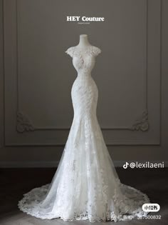 the back of a wedding dress on display in front of a white background with text that reads hey couture