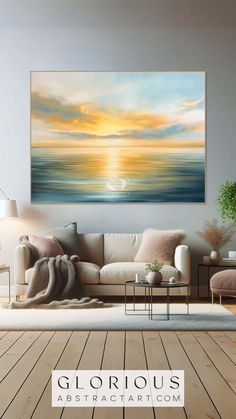 a living room filled with furniture and a large painting on the wall above it's couch