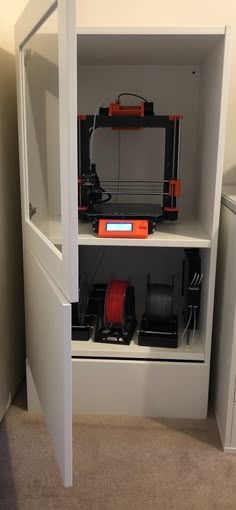 a 3d printer is sitting on top of a shelf