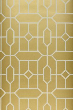 a gold and white wallpaper with geometric design on it's side, in an otherwise plain setting