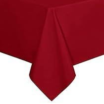 a plain red tablecloth on a white background, with the center piece folded down