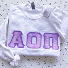 This trendy, unique, handcrafted Pink & Purple Cloud Gildan Greek Letter Crewneck Sweatshirt is sure to stand out on any campus! Grab one for you, your big/little, or a group of sisters (bulk discount information can be found below). If you need some greek letter sweatshirt inspiration, please visit the inspiration page! Picture Details Pictures: ⭑ #1-4: White sweatshirt, Light Purple background fabric Care Instructions ⭑ Wash inside out on cold & air dry for best results ⭑ Do not dry clean ⭑ Li Sorority Sweatshirts, Letter Hoodie, Sorority Big Little