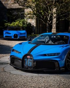 a blue bugatti is parked on the street