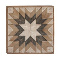 a wooden wall hanging with an arrow design on it's side and wood strips in the middle