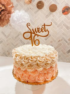 there is a cake that has the number sixteen on it and flowers in the background